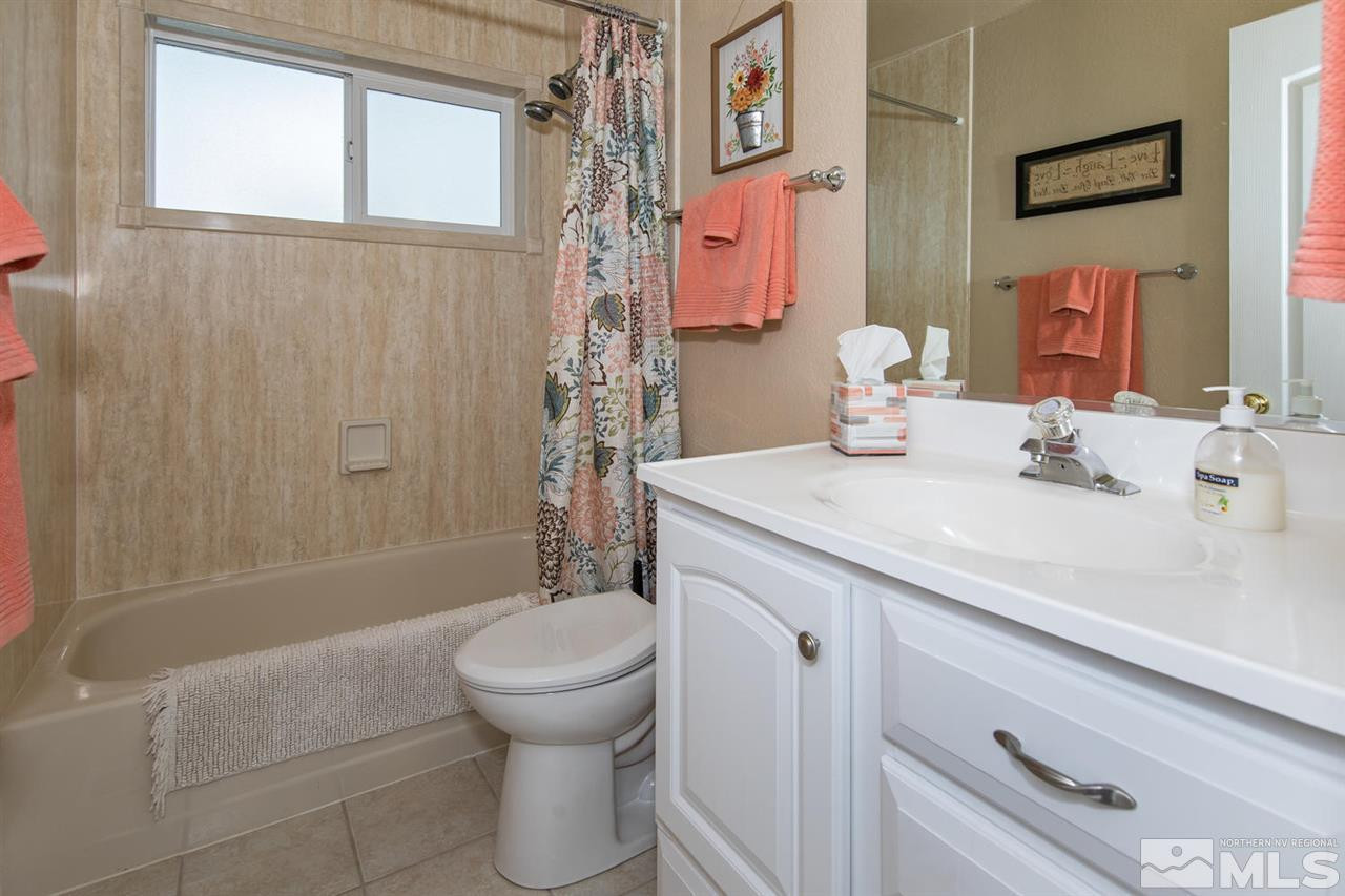 2910 Severn Drive Reno, NV 89503 - Photo 15 of 23 a bathroom with a sink toilet and shower