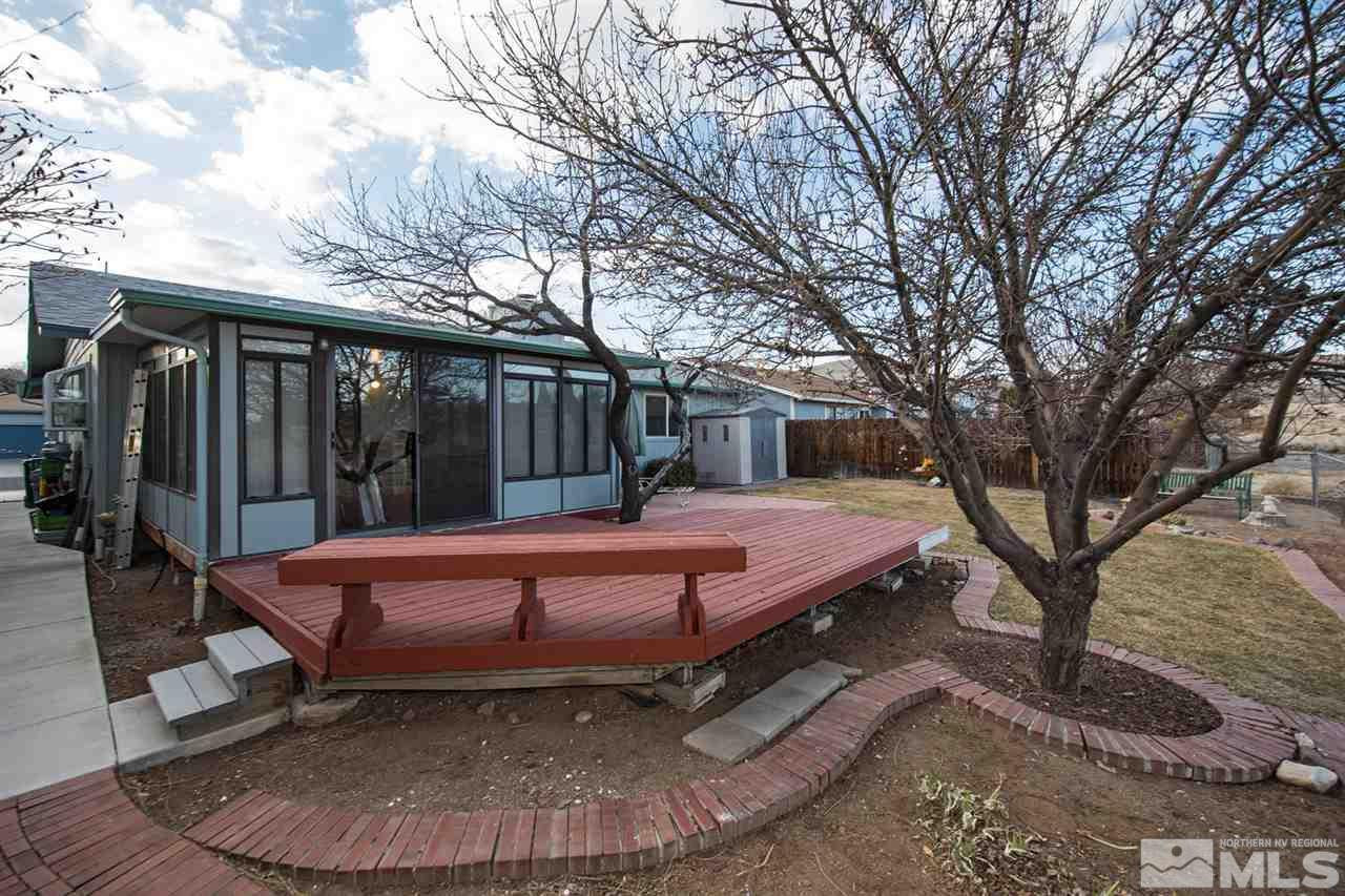 2910 Severn Drive Reno, NV 89503 - Photo 16 of 23 a swimming pool with outdoor seating and yard