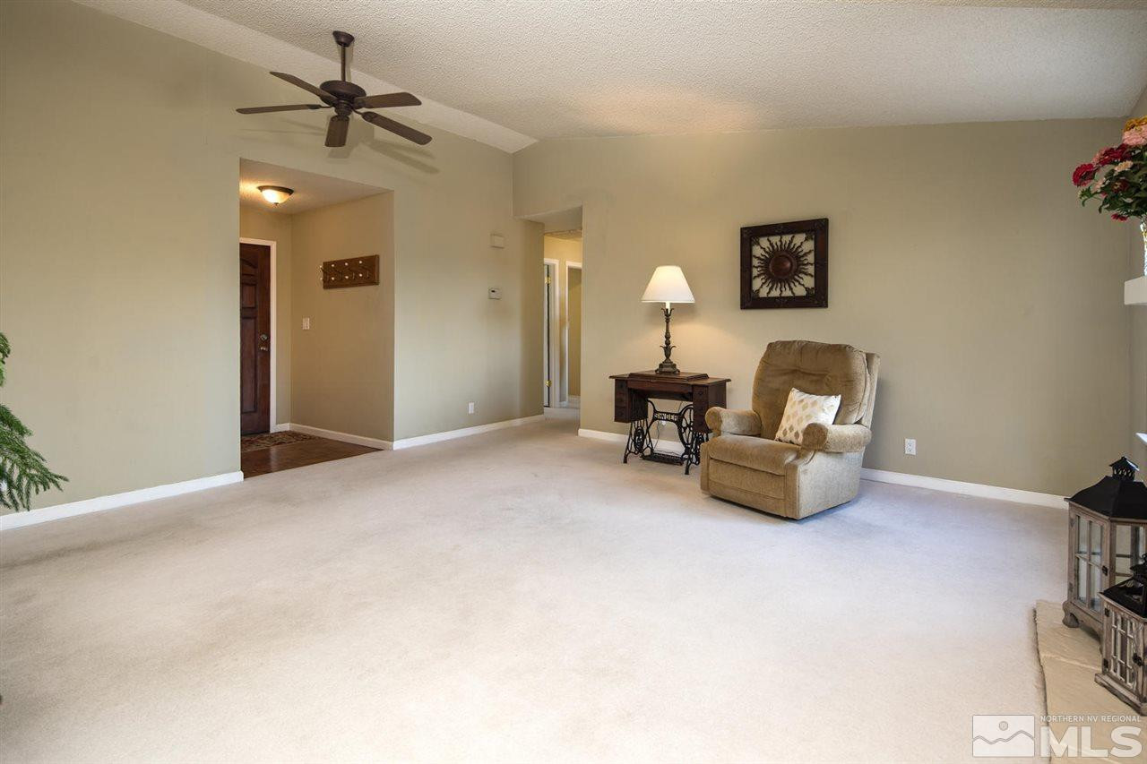 2910 Severn Drive Reno, NV 89503 - Photo 3 of 23 a living room with furniture and a chandelier