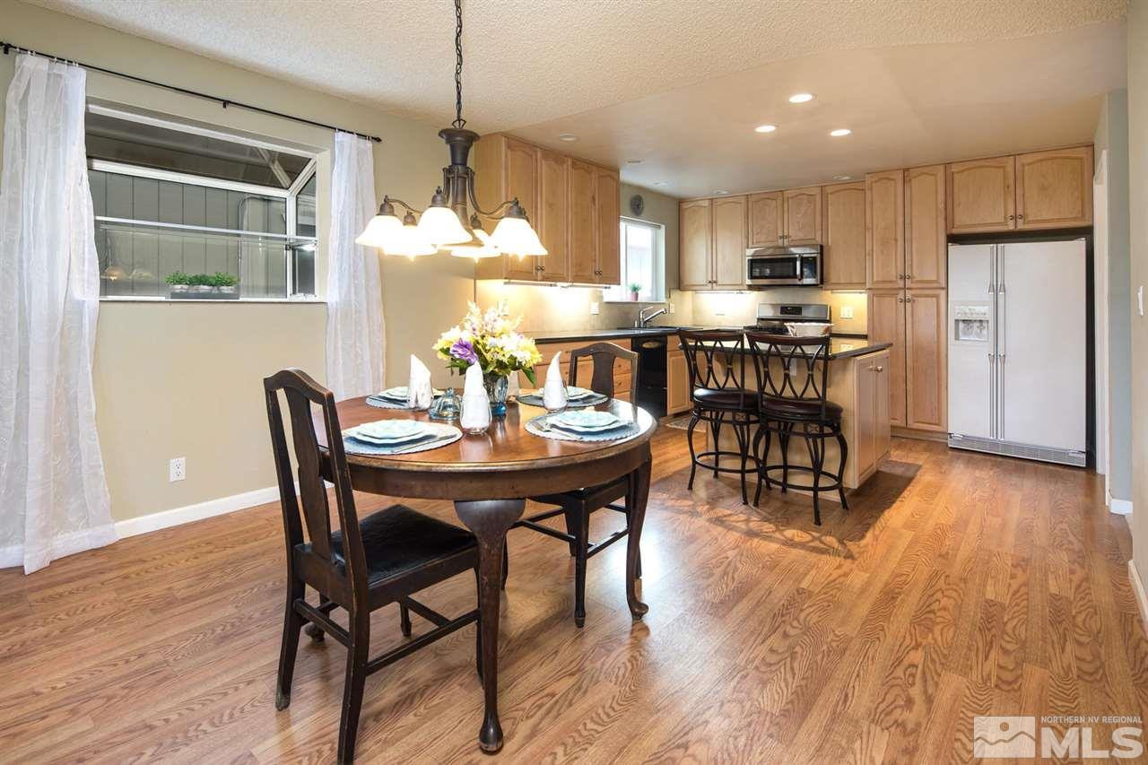 2910 Severn Drive Reno, NV 89503 - Photo 9 of 23 a dining room filled chandelier and wooden floor