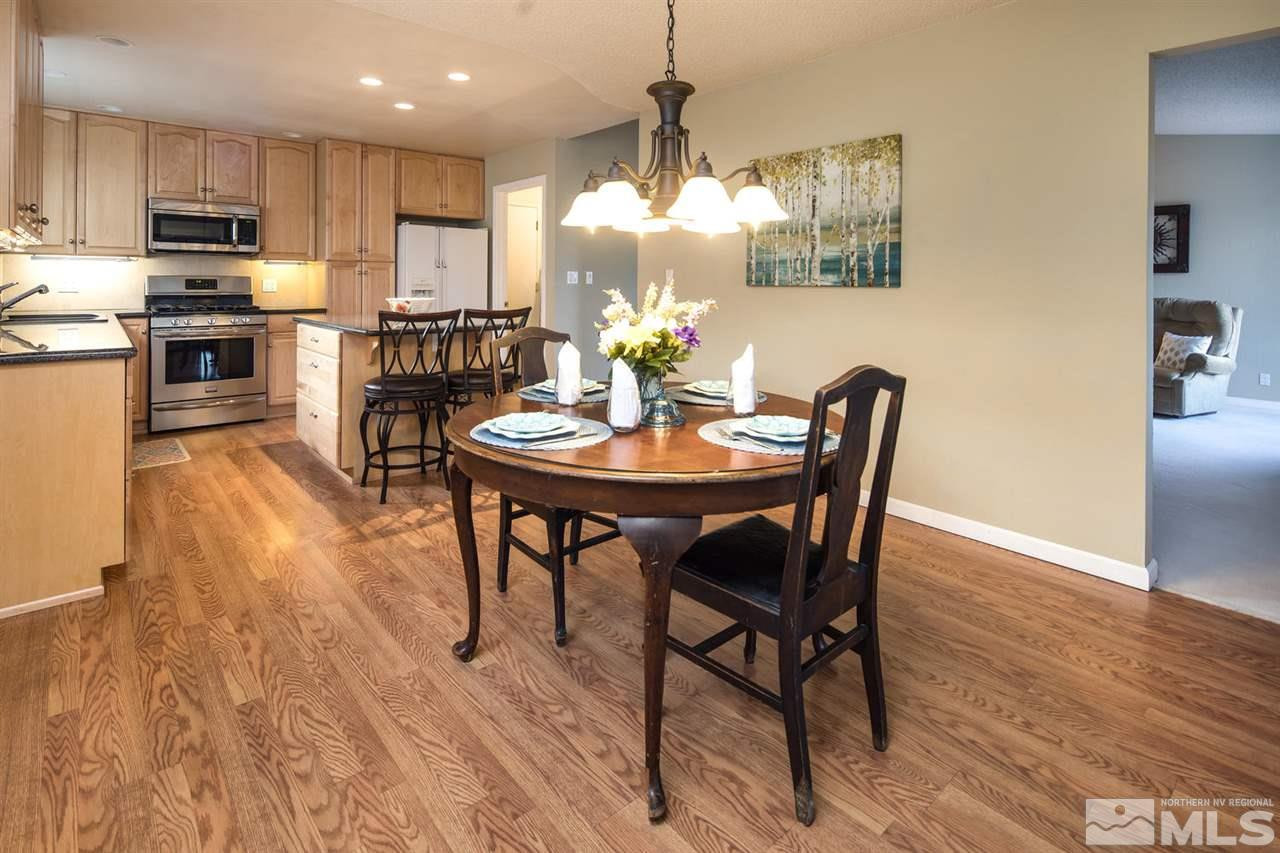 2910 Severn Drive Reno, NV 89503 - Photo 10 of 23 a view of a dining room with furniture a chandelier and wooden floor