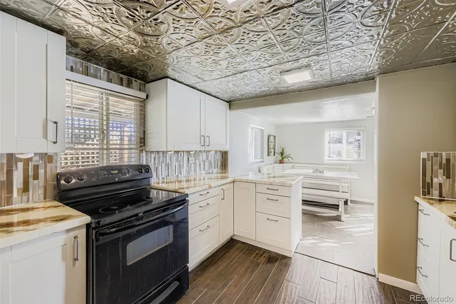 a kitchen with stainless steel appliances a stove sink and cabinets