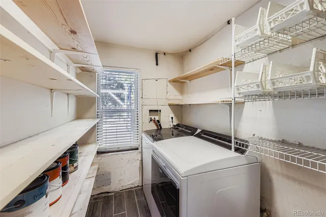 a view of entryway with wooden floor and a livingroom