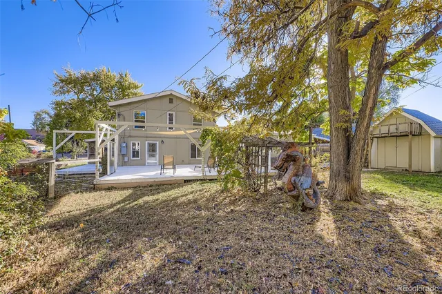 a picture of a room with a white wall and a picture