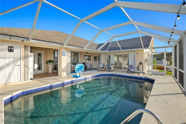 a indoor swimming pool with outdoor seating