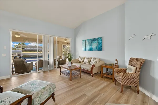 a living room with furniture wooden floor and a table
