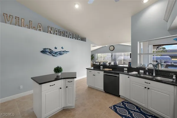 a kitchen with a sink and cabinets
