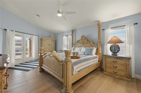 a bed room with a bed and a chandelier