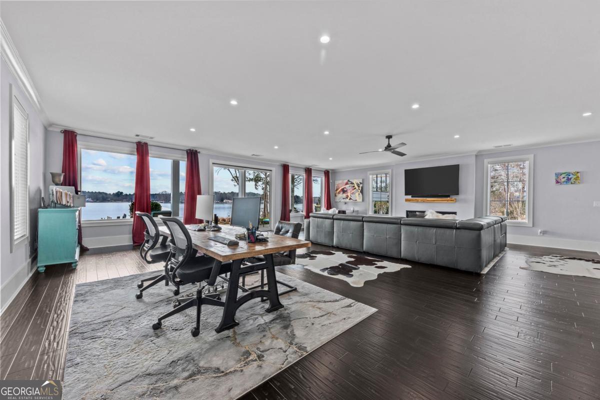 312 Cold Branch Road Eatonton, GA 31024 - Photo 17 of 75 a living room with furniture kitchen view and a wooden floor