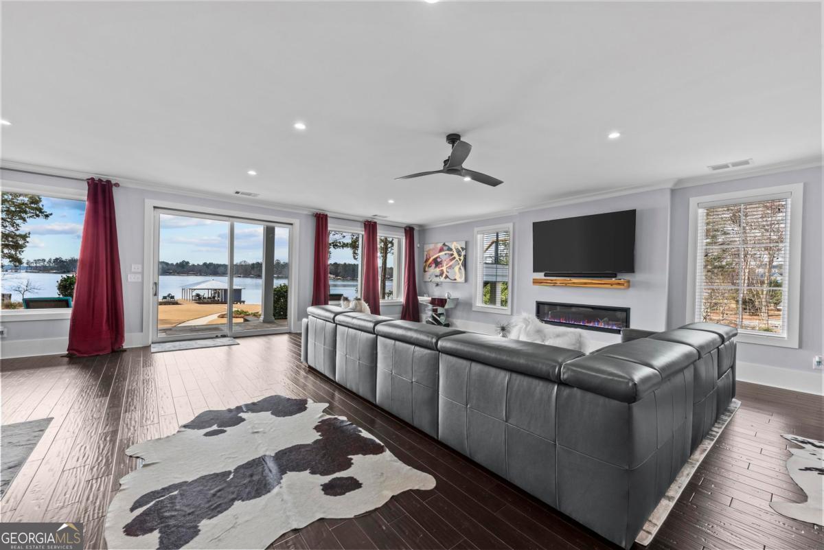312 Cold Branch Road Eatonton, GA 31024 - Photo 18 of 75 a living room with furniture and a flat screen tv
