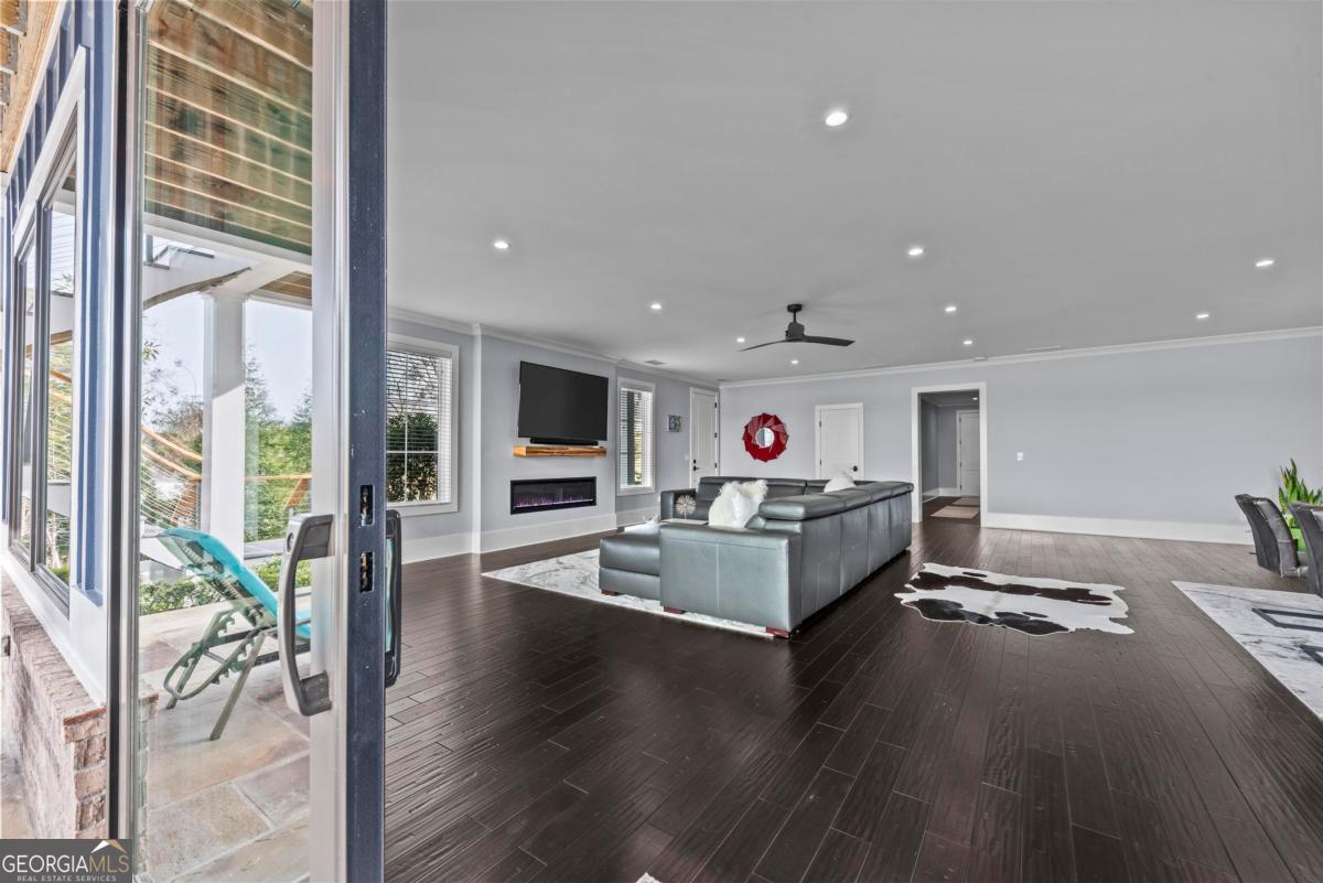 312 Cold Branch Road Eatonton, GA 31024 - Photo 19 of 75 a living room with furniture and a flat screen tv