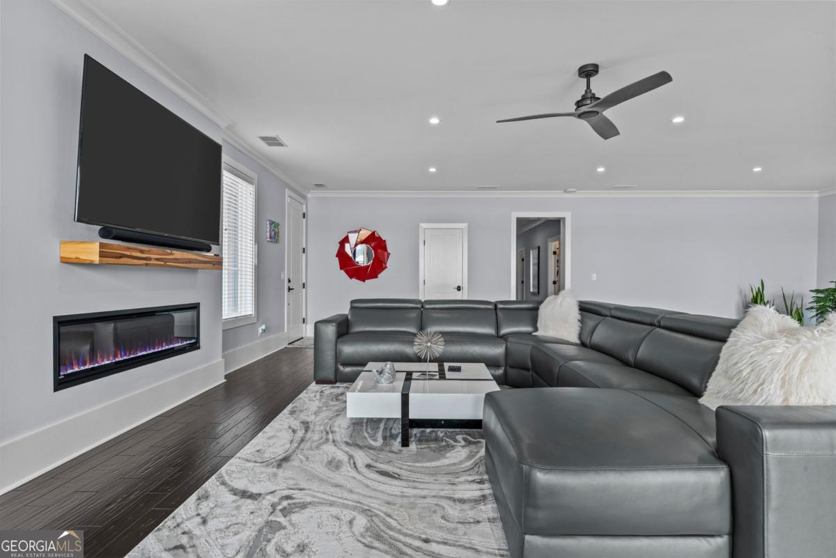 312 Cold Branch Road Eatonton, GA 31024 - Photo 21 of 75 a living room with furniture and a fireplace