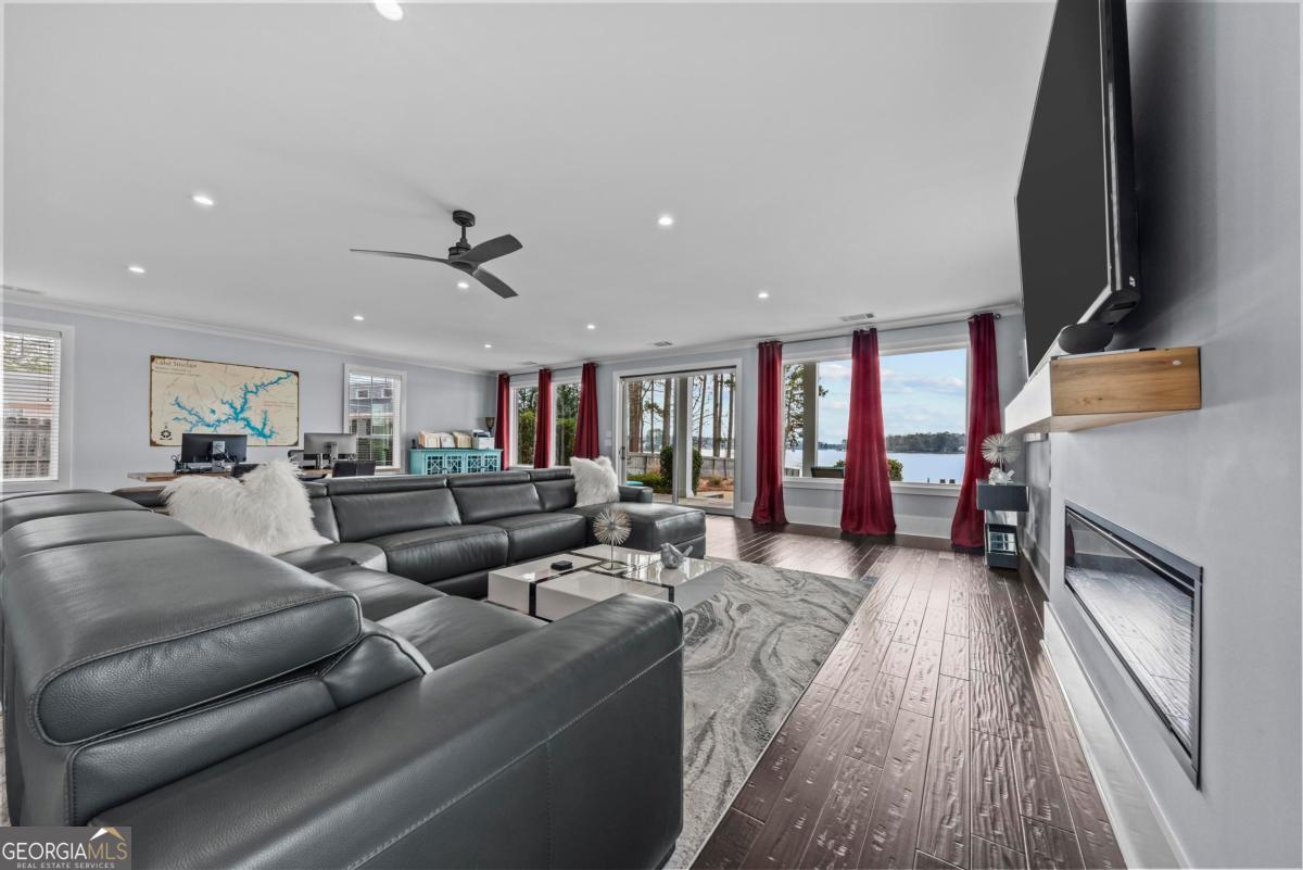 312 Cold Branch Road Eatonton, GA 31024 - Photo 22 of 75 a living room with furniture and a flat screen tv
