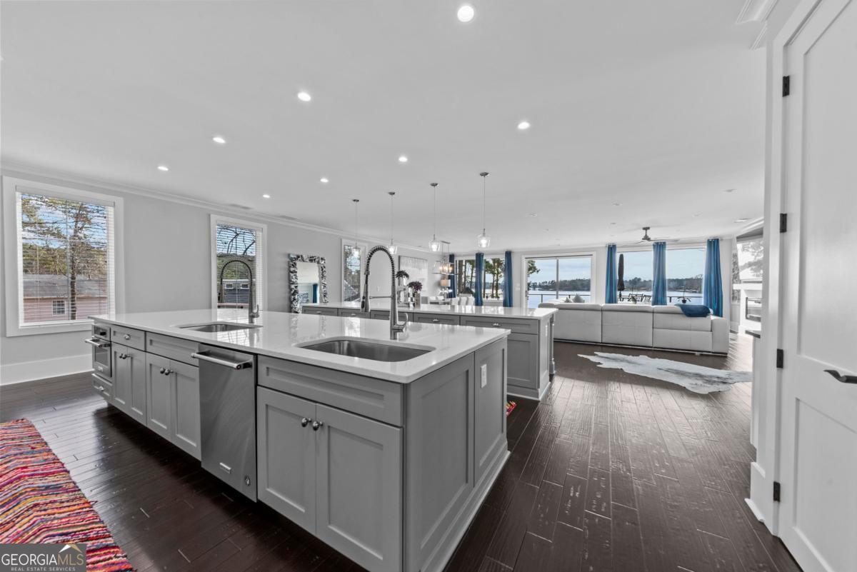 312 Cold Branch Road Eatonton, GA 31024 - Photo 26 of 75 a kitchen with counter top space sink and stainless steel appliances