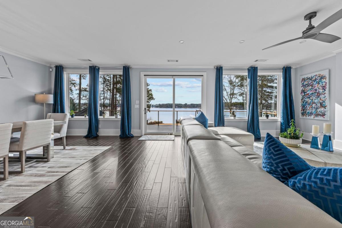 312 Cold Branch Road Eatonton, GA 31024 - Photo 34 of 75 a spacious bedroom with a large bed and a large window