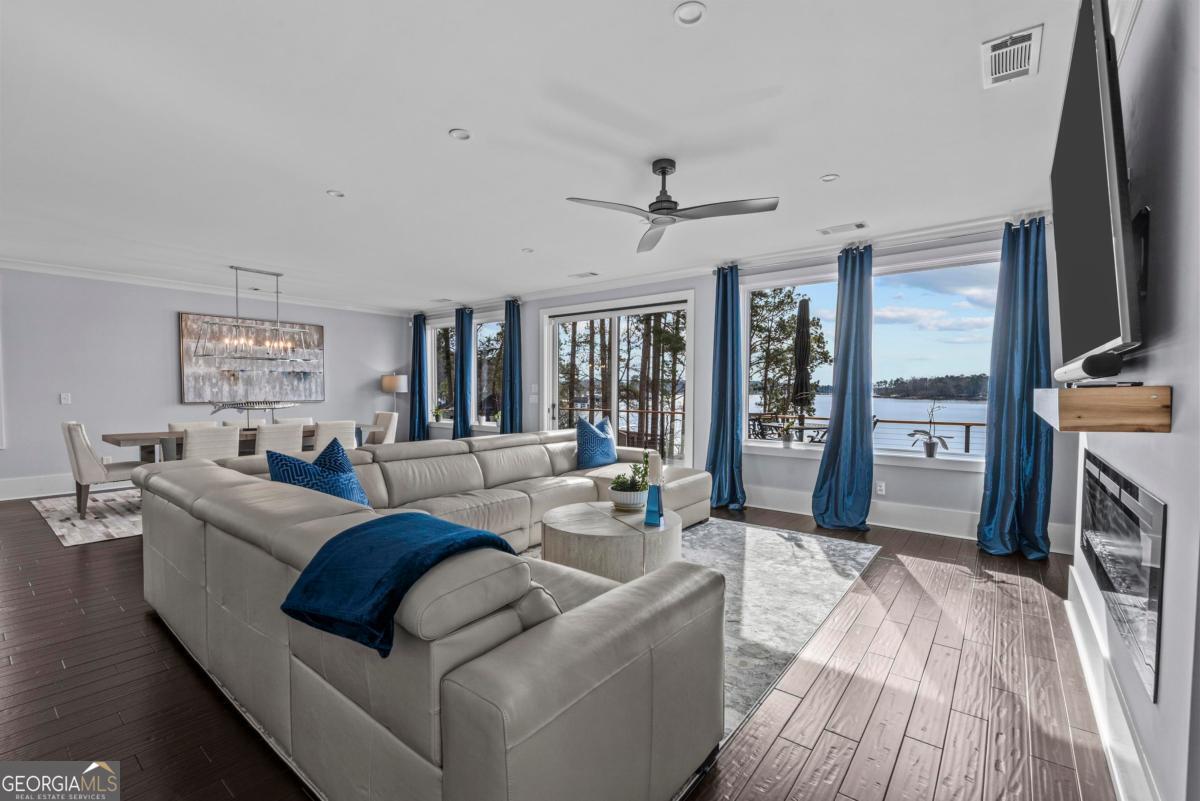 312 Cold Branch Road Eatonton, GA 31024 - Photo 38 of 75 a living room with furniture and a flat screen tv