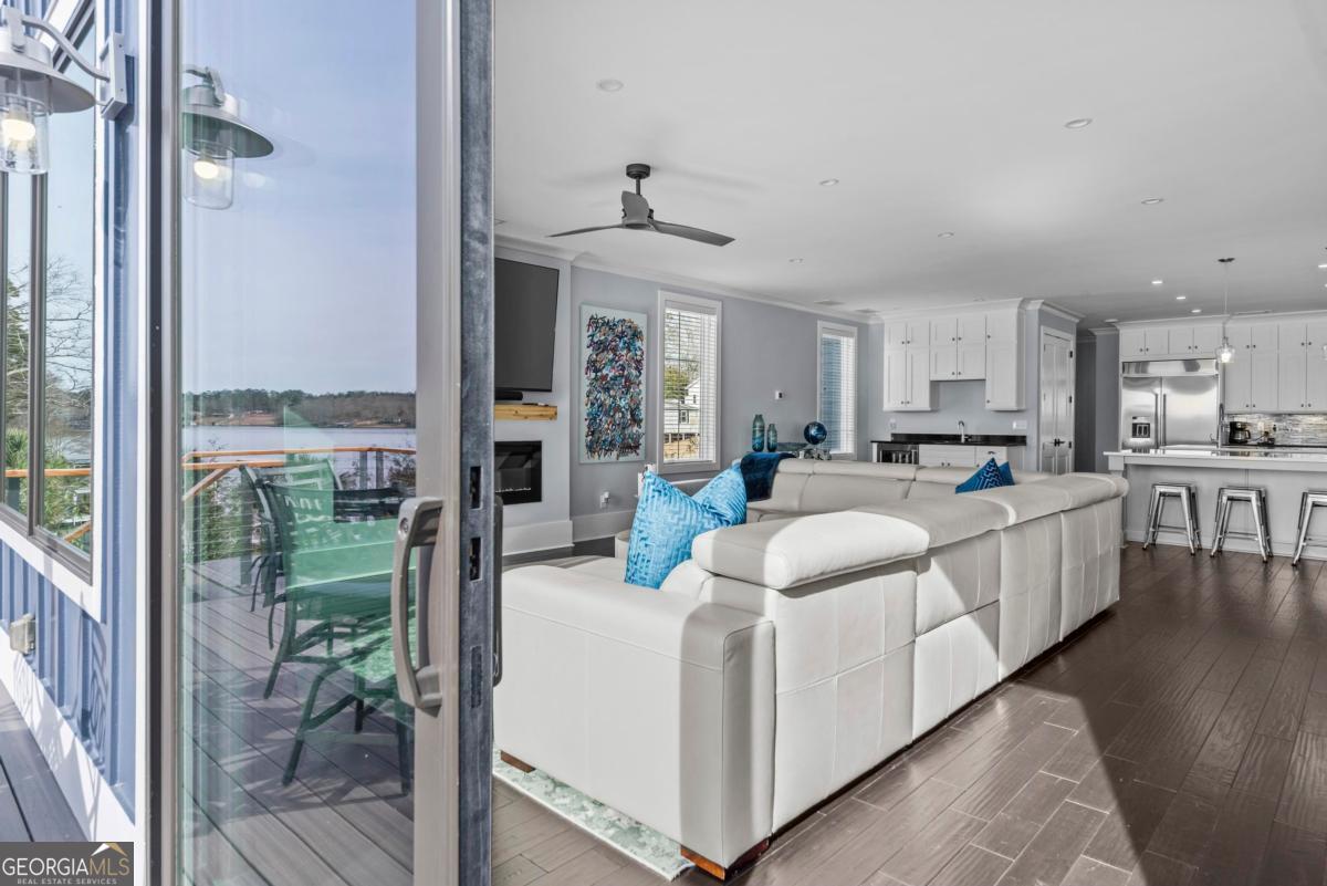 312 Cold Branch Road Eatonton, GA 31024 - Photo 41 of 75 a kitchen with kitchen island a large counter top space a sink stainless steel appliances and cabinets