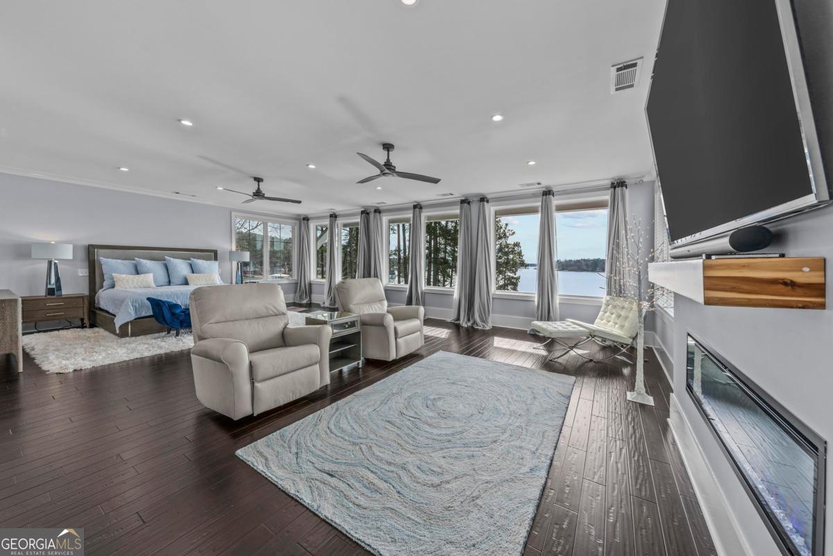 312 Cold Branch Road Eatonton, GA 31024 - Photo 50 of 75 a living room with furniture and a flat screen tv