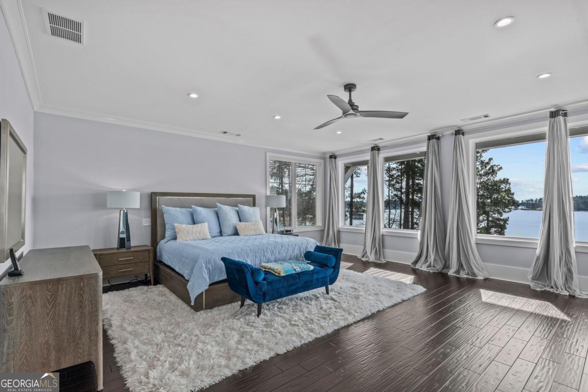 312 Cold Branch Road Eatonton, GA 31024 - Photo 51 of 75 a bedroom with a large bed and a large window