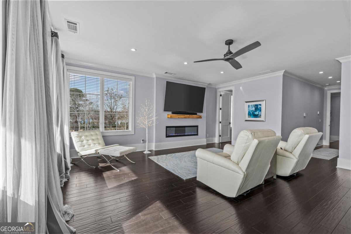312 Cold Branch Road Eatonton, GA 31024 - Photo 53 of 75 a living room with fireplace furniture and a flat screen tv