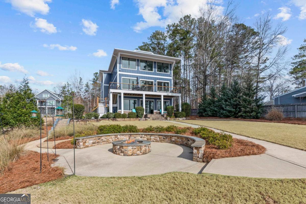 312 Cold Branch Road Eatonton, GA 31024 - Photo 63 of 75 a view of a house with backyard and sitting area
