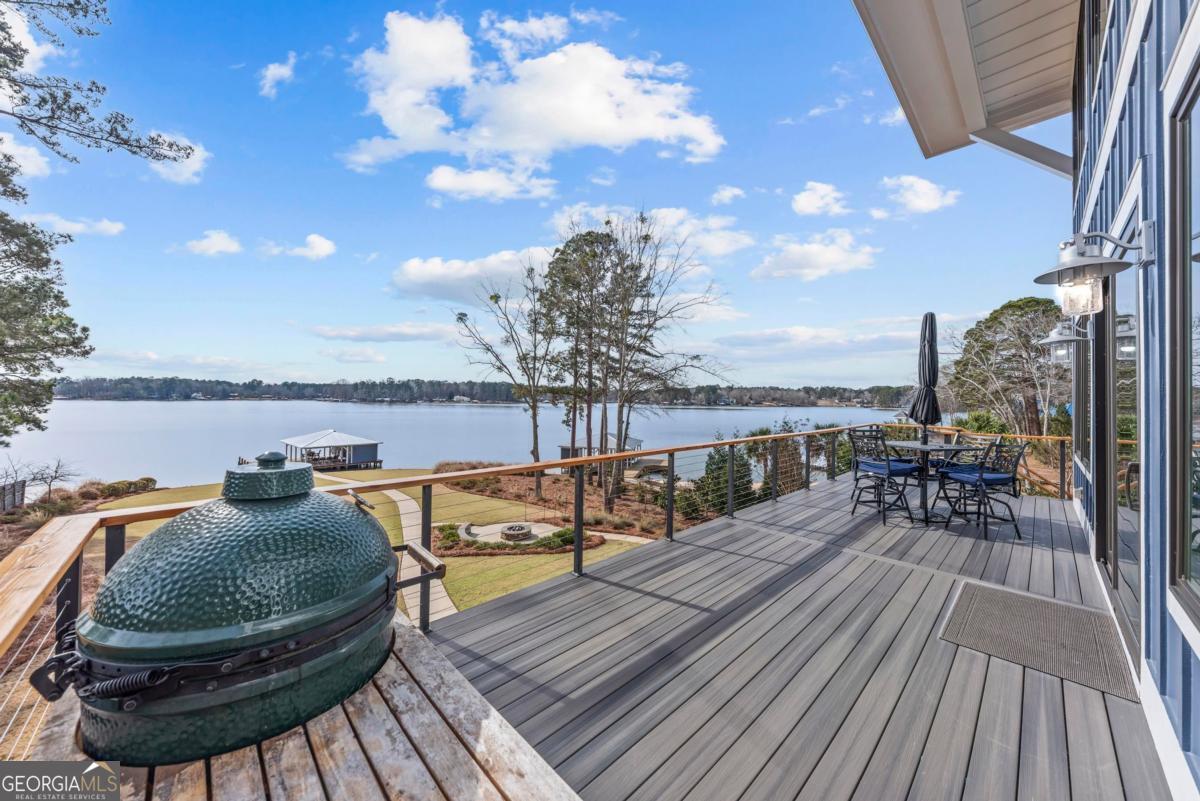 312 Cold Branch Road Eatonton, GA 31024 - Photo 67 of 75 a balcony with wooden floor table and chairs