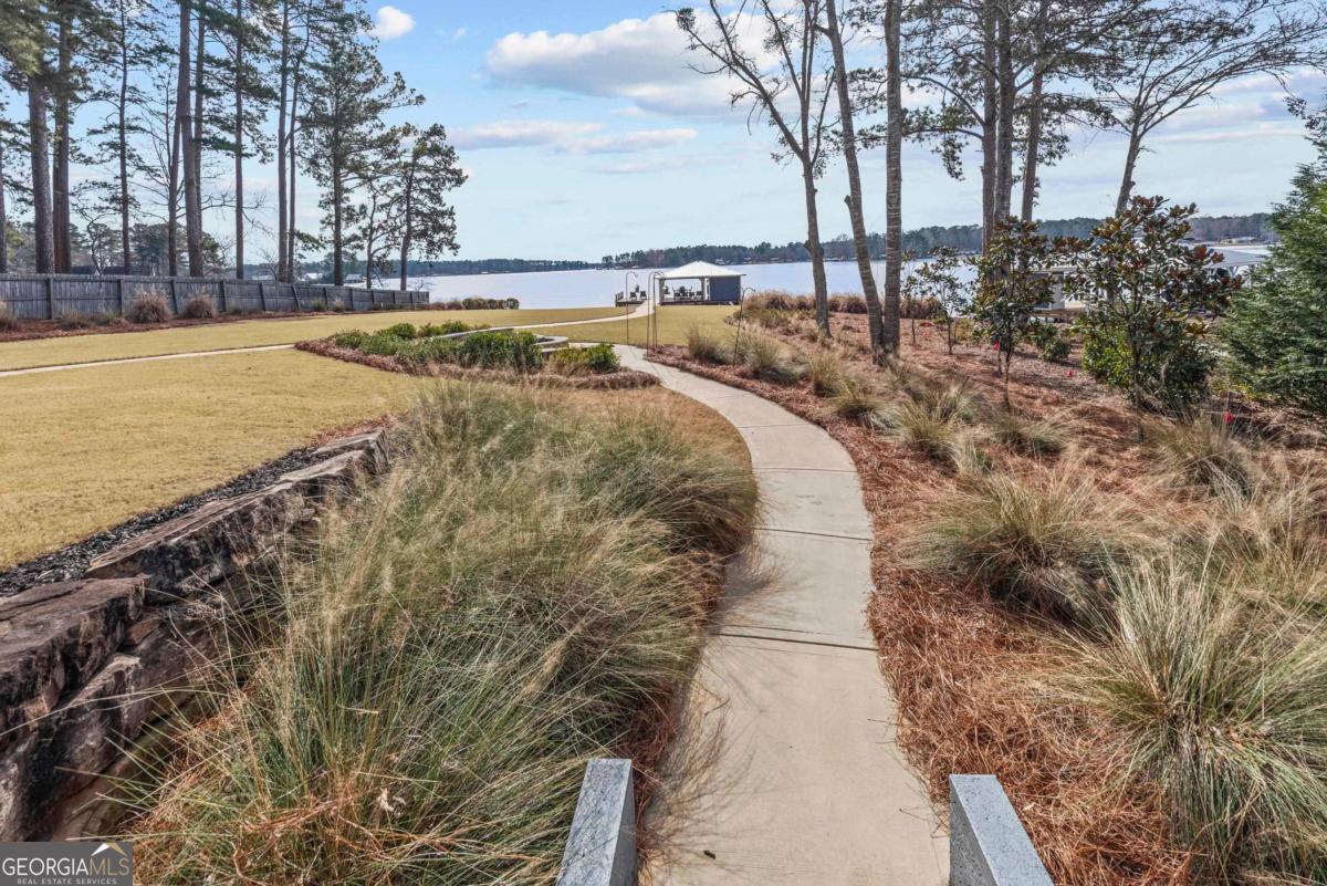 312 Cold Branch Road Eatonton, GA 31024 - Photo 68 of 75 a view of a swimming pool with an outdoor space and seating area