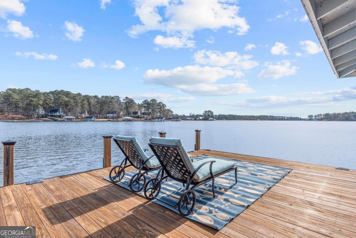 312 Cold Branch Road Eatonton, GA 31024 - Photo 70 of 75 a view of a lake with table and chairs