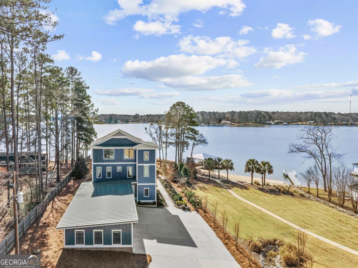 312 Cold Branch Road Eatonton, GA 31024 - Photo 8 of 75 a view of a swimming pool with a lounge chairs
