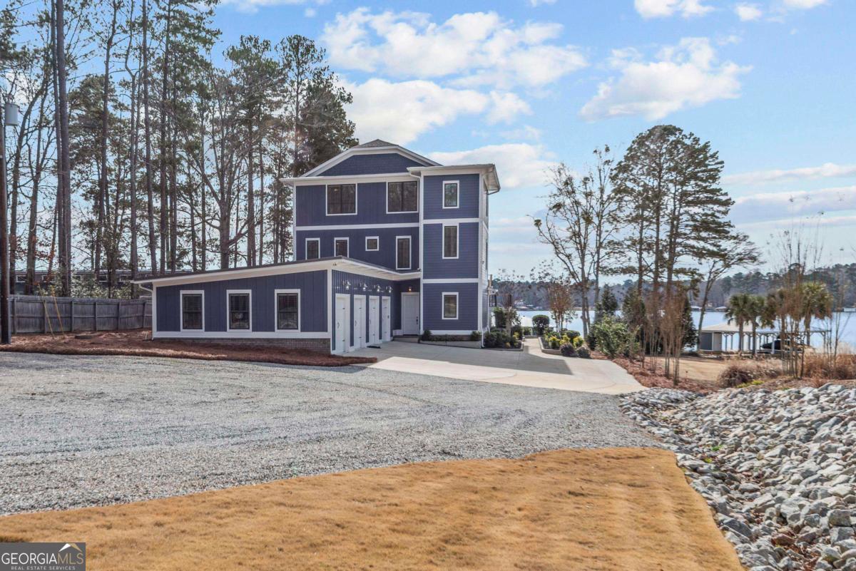 312 Cold Branch Road Eatonton, GA 31024 - Photo 9 of 75 a front view of a house with a yard