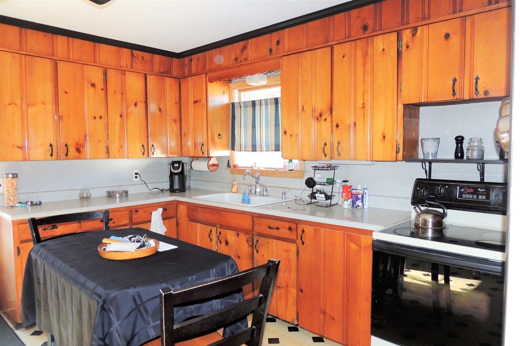 200 Nottingham Street Springfield, MA 01104 - Photo 5 of 14 a kitchen with stainless steel appliances a sink and a stove