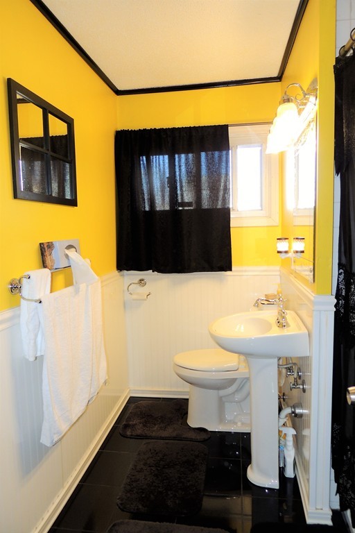 200 Nottingham Street Springfield, MA 01104 - Photo 9 of 14 a bathroom with a sink toilet and mirror