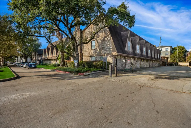 a view of a street with a building in the background