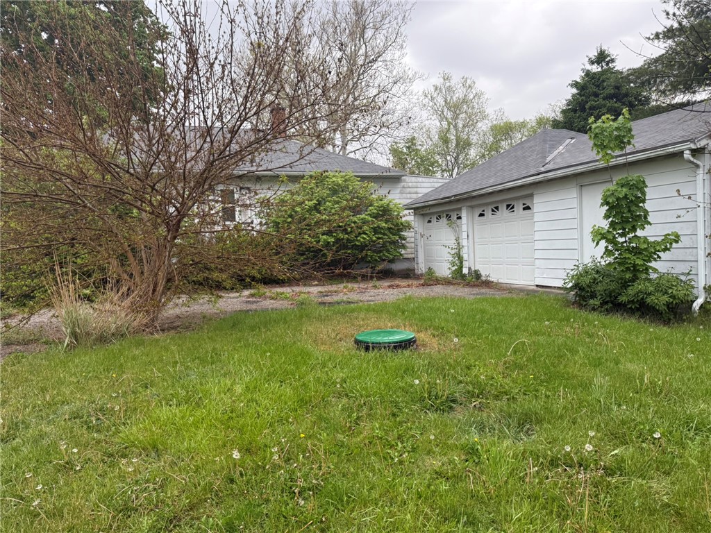121 State Route, Unit 10570 New Paris, OH 45347 - Photo 6 of 8 This property features an attached garage with a classic shingle roof.