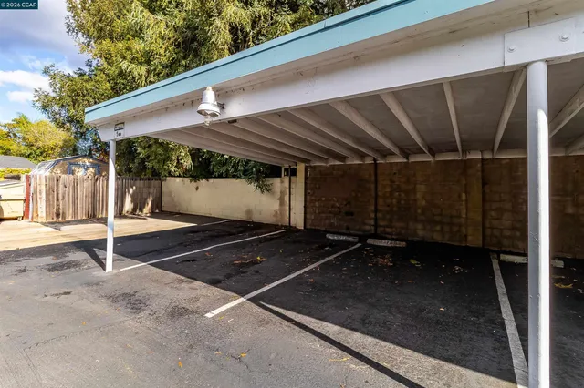 a swimming pool with outdoor seating and yard