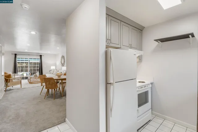 a bathroom with a sink a toilet and a window