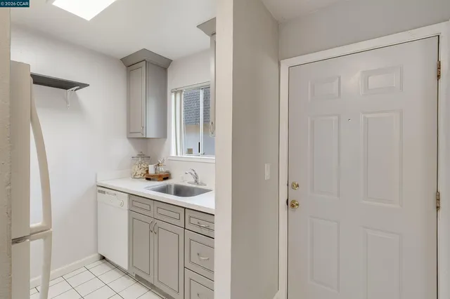 a kitchen with a refrigerator and a stove