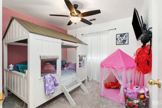 a bedroom with furniture and a window