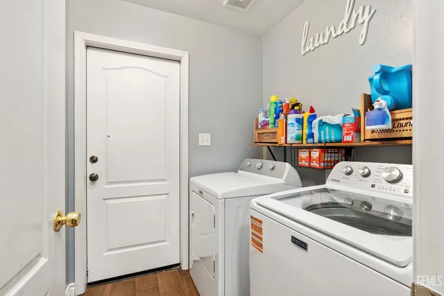 a utility room with dryer and washer