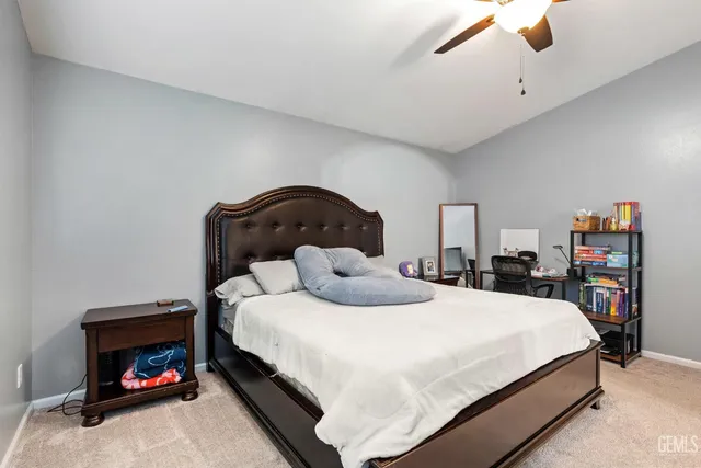 a bedroom with a bed and a fireplace