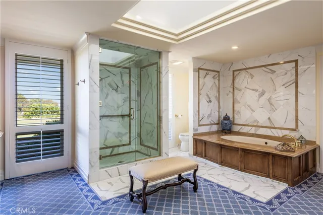 a spacious bathroom with a mirror a sink and a mirror