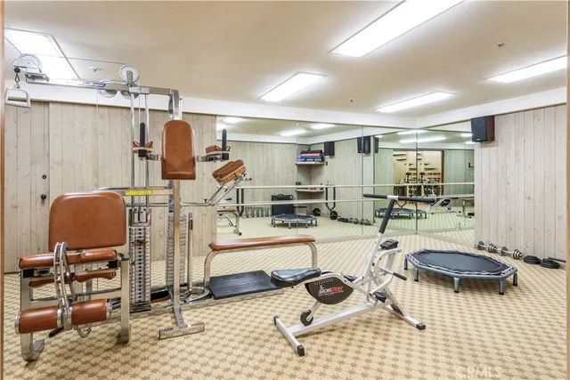 a view of walk in closet with clothes