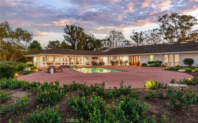 a view of a swimming pool with a table and chairs