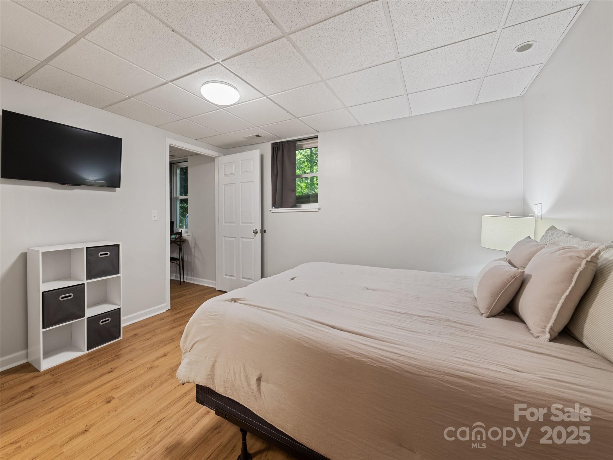 263 Blanton Street Columbus, NC 28722 - Photo 37 of 45 a bedroom with a bed and a flat screen tv