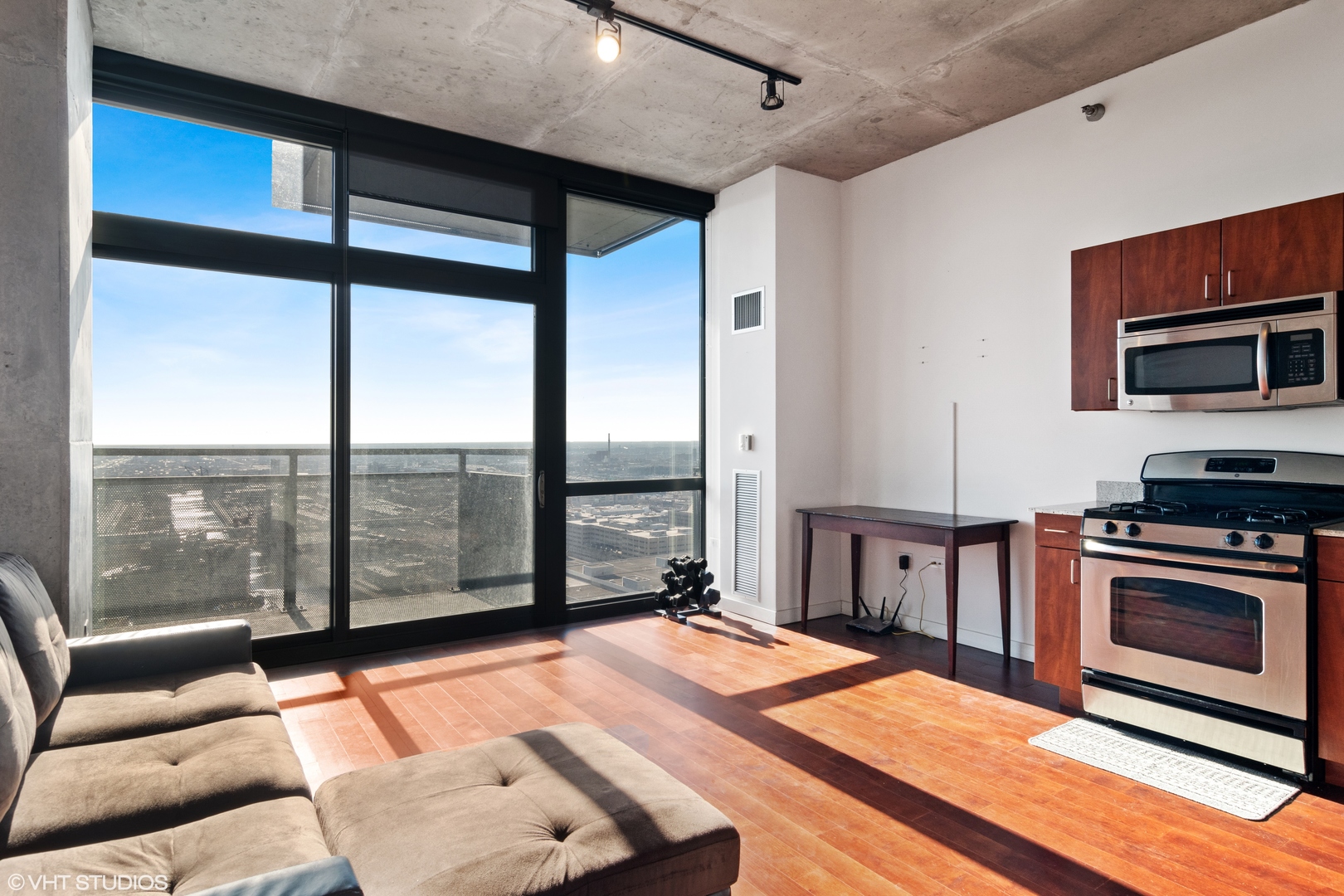 235 West Van Buren Street, Unit 3706 Chicago, IL 60607 - Photo 3 of 13 a living room with a large window