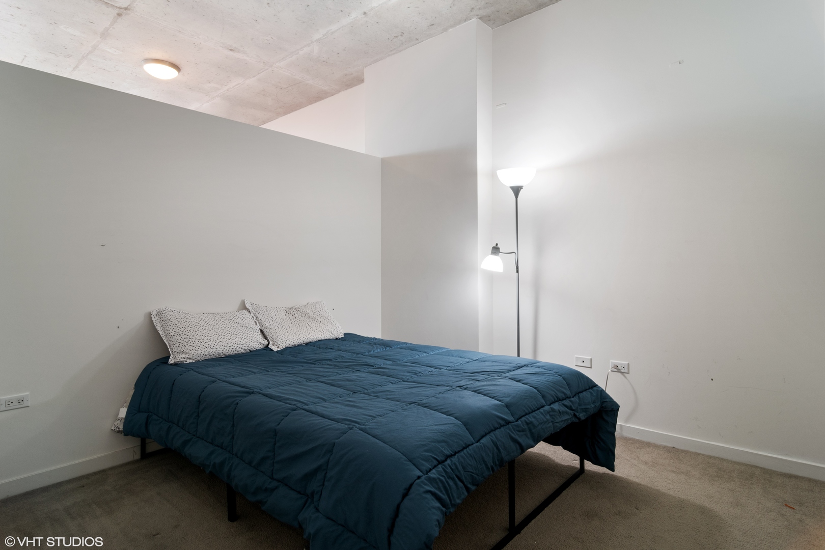 235 West Van Buren Street, Unit 3706 Chicago, IL 60607 - Photo 5 of 13 a bedroom with a bed and a closet