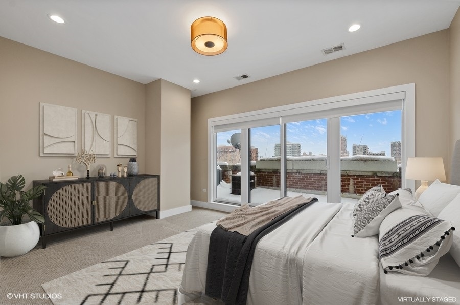 1507 South Prairie Avenue Chicago, IL 60605 - Photo 17 of 25 a bedroom with a bed and a large window
