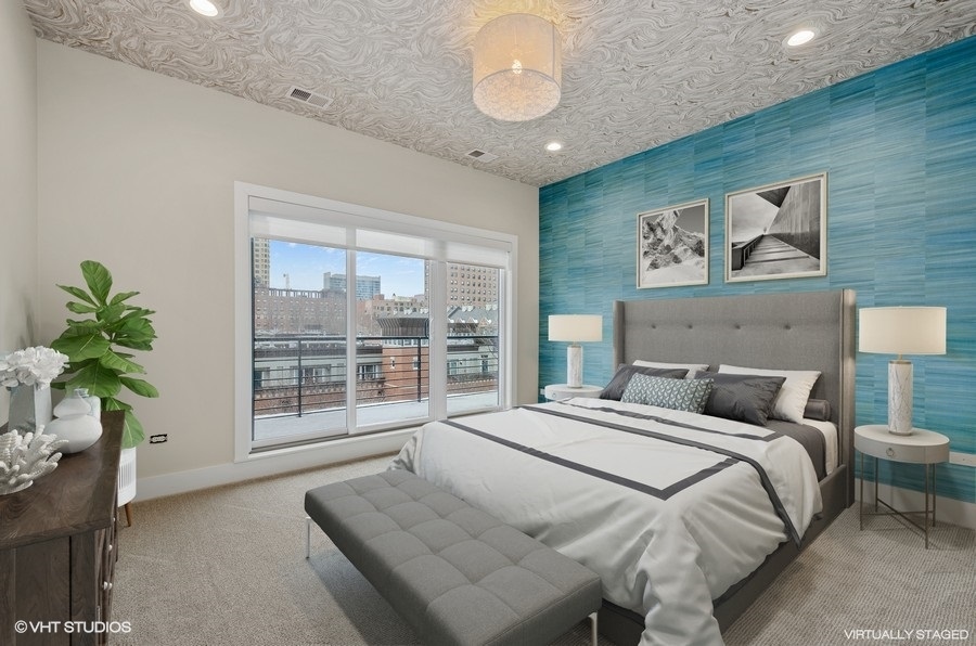 1507 South Prairie Avenue Chicago, IL 60605 - Photo 18 of 25 a bedroom with a large bed and a potted plant
