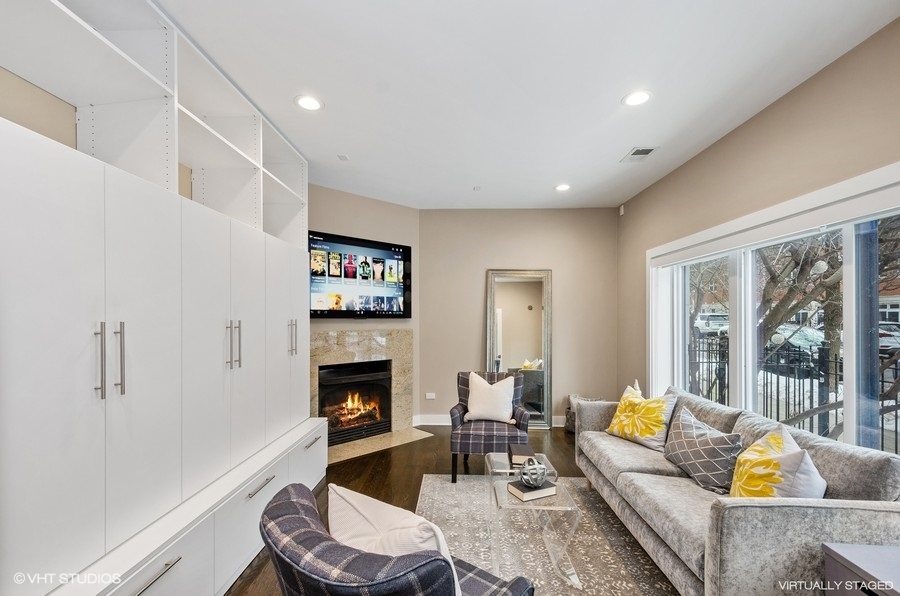 1507 South Prairie Avenue Chicago, IL 60605 - Photo 9 of 25 a living room with furniture a fireplace and a large window
