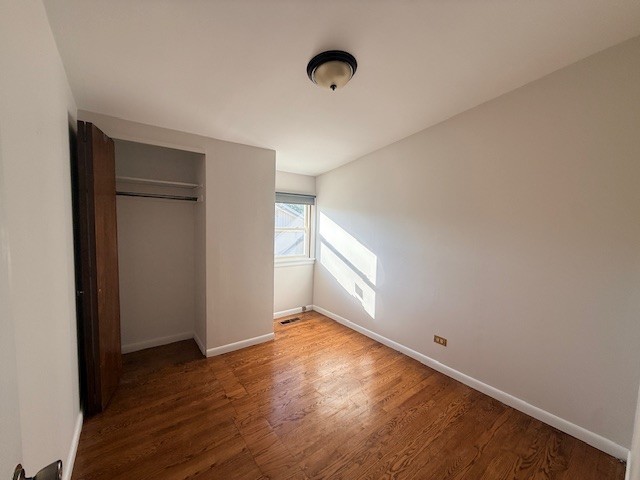 363 Maple Street Glen Ellyn, IL 60137 - Photo 11 of 17 an empty room with wooden floor and windows